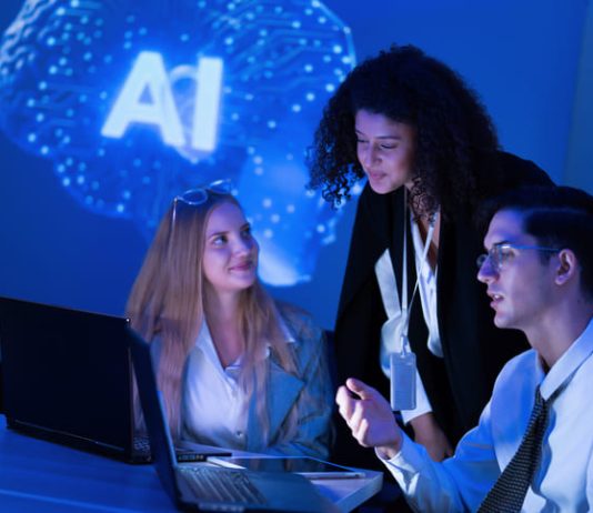 The Human Premium: Why Human Talent Becomes More Valuable in the AI Era Talents in the AI Era. Team strategizing in the workplace with the use of technology