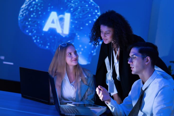 iStock-2253130890 (1) Talents in the AI Era. Team strategizing in the workplace with the use of technology
