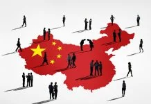Businessman miniature and China map background. China’s Changing Business Etiquette in 2026