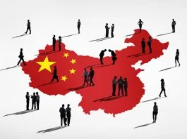 Businessman miniature and China map background. China’s Changing Business Etiquette in 2026