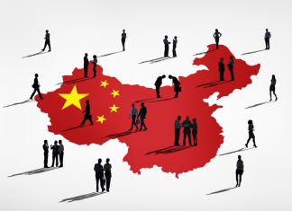 Businessman miniature and China map background. China’s Changing Business Etiquette in 2026