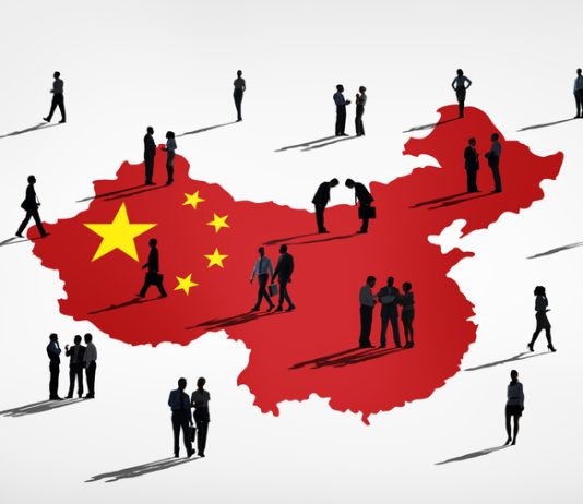 Businessman miniature and China map background. China’s Changing Business Etiquette in 2026