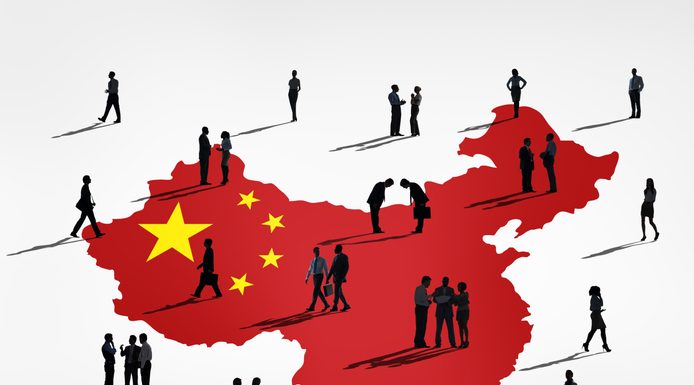 Businessman miniature and China map background. China’s Changing Business Etiquette in 2026