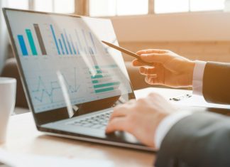 UK SMEs are Outgrowing Off-the-Shelf Software – Here is Where the Money is Going UK SMEs using Black laptop