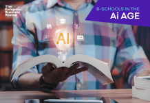 Building Responsible AI-Enabled Leaders: Surrey Business School’s Human-Centred Approach to AI in Education Close-up of student holding open book displaying glowing light bulb hologram containing artificial intelligence icon, representing innovation in modern education plus futuristic learning
