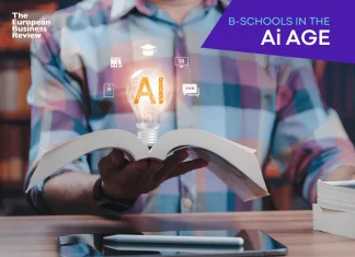 Close-up of student holding open book displaying glowing light bulb hologram containing artificial intelligence icon, representing innovation in modern education plus futuristic learning