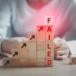 Text failed on the wooden block and the dartboard icon is on the floor, Failing ideas metaphor, Concept for challenge and fail in business or fail in Career Goal