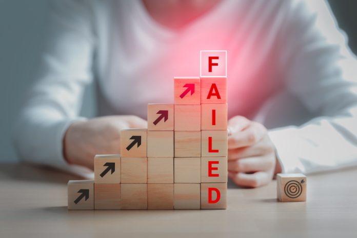 Text failed on the wooden block and the dartboard icon is on the floor, Failing ideas metaphor, Concept for challenge and fail in business or fail in Career Goal