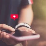 A Balanced Review of Datingriviera, Its Advantages and Drawbacks Datingriviera Review - smart phone with heart icon