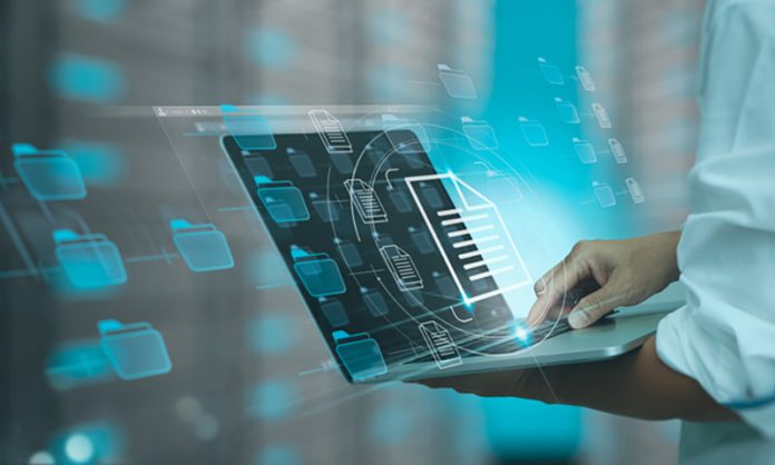 Businessman working modern compter Document Management System (DMS),Virtual online documentation database and process automation to efficiently manage files, knowledge and documentation in enterprise with ERP. DocuWare