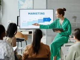 International Day of Marketing: Five Practical Skills CMOs Need Right Now Businesswoman giving new info about marketing. Learning practical Skills for CMO