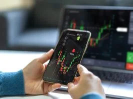How Evaluation Rules Shape Your Mindset in Futures Prop Trading Successful of trader use phone and laptop prop trading stock exchange graph money
