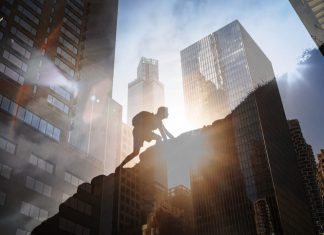 Man climbing up steep mountain. Business, achievement, success. Kabbalistic insights for success concept