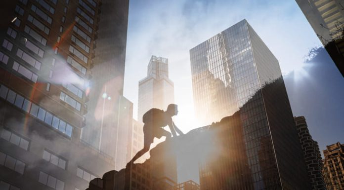 Man climbing up steep mountain. Business, achievement, success. Kabbalistic insights for success concept