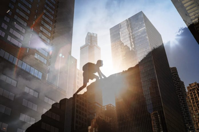 Man climbing up steep mountain. Business, achievement, success. Kabbalistic insights for success concept