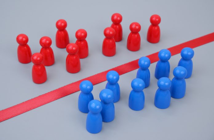 Groups of blue and red people figures separated by red line. roups of blue and red people figures separated by red line. Geopolitica risks