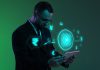 Businessman with digital currency icons and green holographic interface in neon lightning.