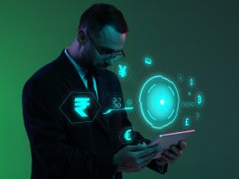 Businessman with digital currency icons and green holographic interface in neon lightning.