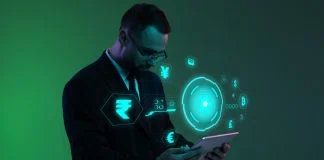 Businessman with digital currency icons and green holographic interface in neon lightning.