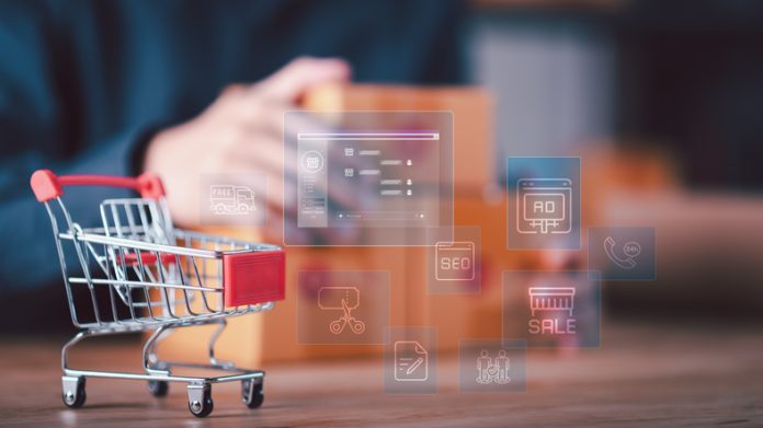 Mini shopping cart with floating hologram icons including SEO, sale, ads, and delivery features depicting the concept of digital commerce, e-marketing tools, and customer-centric online services. AI in e-commerce