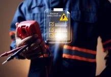 Why Electrical Safety Should Be a Business Priority electrical safety concept with electric staff holding multimeter to check power source before start working on machine system or construction site