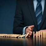 5 Signs Your Information Architecture is Failing You as a Leader Businessman stop domino effect. Architecture is Failing You as a Leader concept