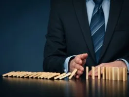 5 Signs Your Information Architecture is Failing You as a Leader Businessman stop domino effect. Architecture is Failing You as a Leader concept