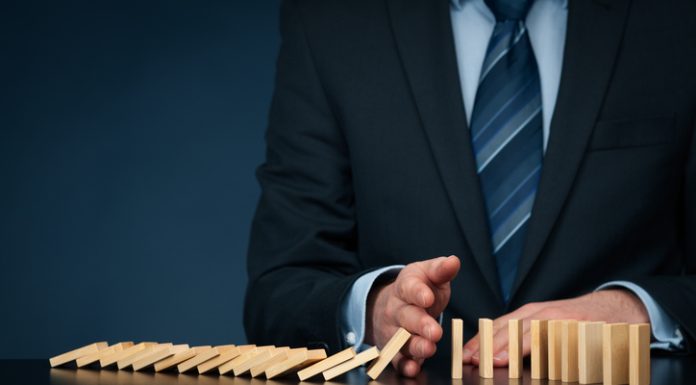 5 Signs Your Information Architecture is Failing You as a Leader Businessman stop domino effect. Architecture is Failing You as a Leader concept