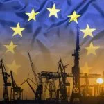 Industrial concept with European Union flag at sunset