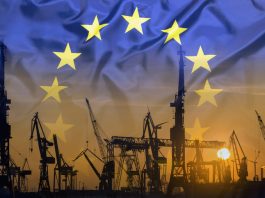 Industrial concept with European Union flag at sunset