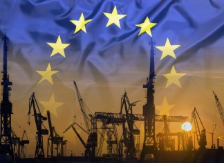 Industrial concept with European Union flag at sunset