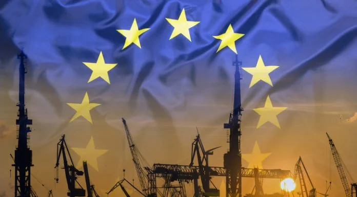 The New Industrial Realism: Why Europe Must Choose Integration Over Protectionism Industrial concept with European Union flag at sunset