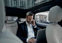 Executive working in the car for logistics tasks
