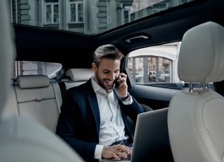 Executive working in the car for logistics tasks