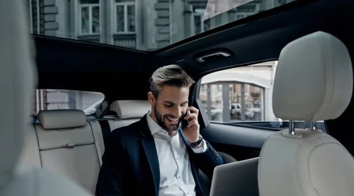 Executive working in the car for logistics tasks