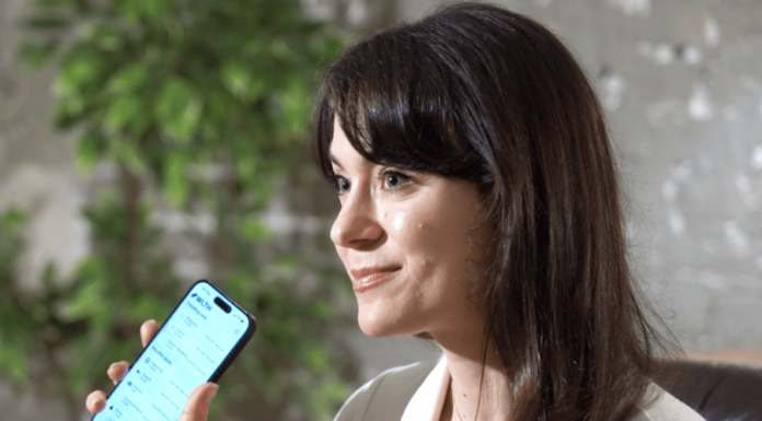 The Summer of Pre-IPO: Why the Average Investor is Still Locked Out wooman holding mobile phone for Pre-IPO