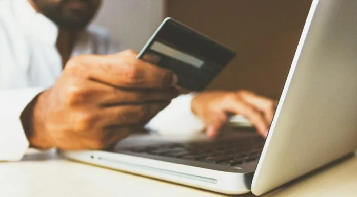 Stock photo of the Business Man with a credit card. Billion-Euro Problem concept