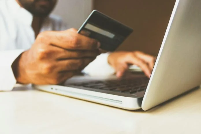 rupixen-Q59HmzK38eQ-unsplash (1) (1) (1) Stock photo of the Business Man with a credit card. Billion-Euro Problem concept