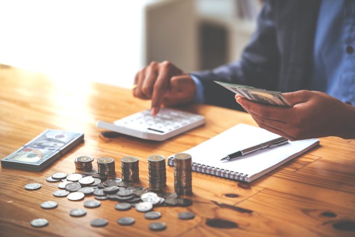 money saving business On a table with sunlight. Money Saving Ideas for Financial Accounting Private Banking