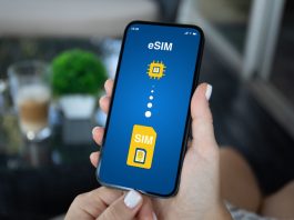 Europe eSIM vs Roaming: What Should Travellers Choose? Woman hand hold phone with Sim card replacement on eSim