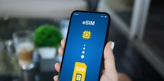 Woman hand hold phone with Sim card replacement on eSim