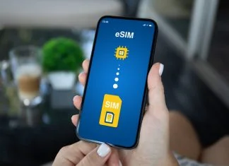 Woman hand hold phone with Sim card replacement on eSim