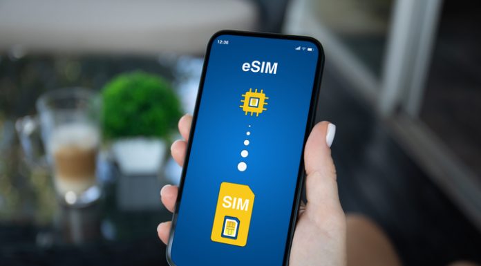 Europe eSIM vs Roaming: What Should Travellers Choose? Woman hand hold phone with Sim card replacement on eSim