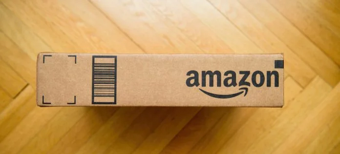 View from above of Amazon prime cardboard carton package Amazon prime cardboard carton package on the wooden floor