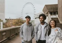 Why the Best Streetwear in the UK are Built on Community, Not Advertising Three friends strolling in London wearing UK streetwear