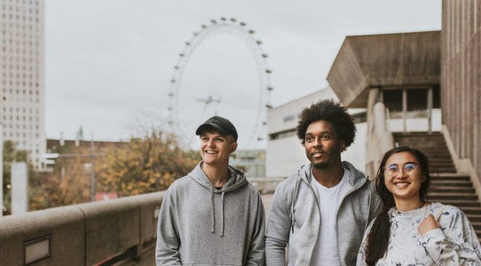 Why the Best Streetwear in the UK are Built on Community, Not Advertising Three friends strolling in London wearing UK streetwear