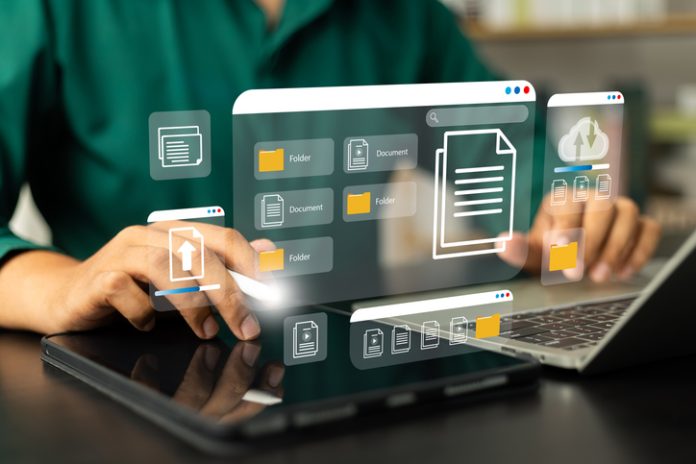 Businessman using computer laptop and dashboard for data management with computer showcasing a cloud-based documentation system for efficient digital file storage,online documentation technology Best Employer of Record Solutions for Businesses Entering New Markets