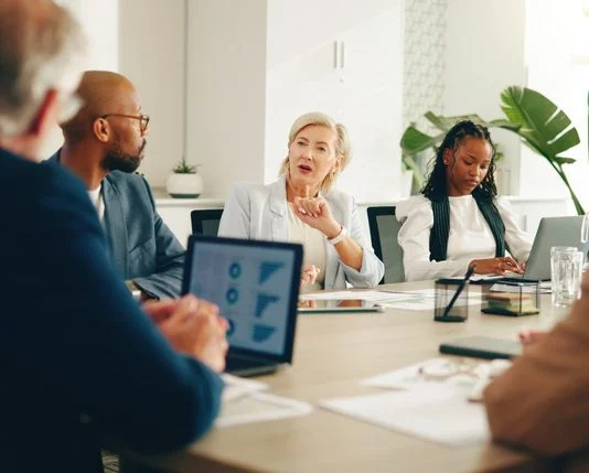 Business leaders in the board discussing Democratisation Tax, finance and expenses