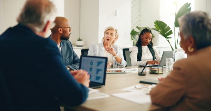 Business leaders in the board discussing Democratisation Tax, finance and expenses