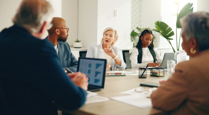 Business leaders in the board discussing Democratisation Tax, finance and expenses